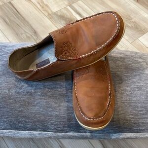 From the original Olukai line, genuine leather slip ons with collapsible heel